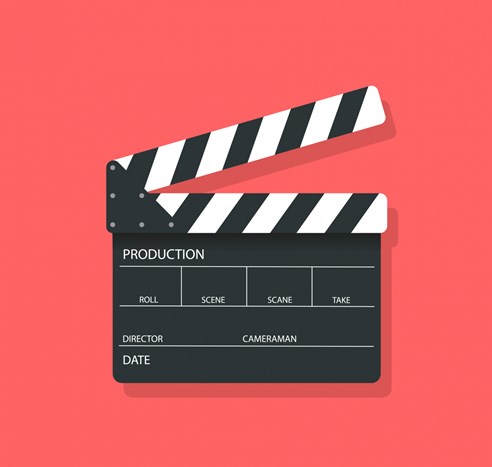 Filmklapp mot röd bakgrund